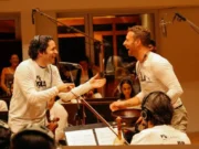 Cómo la amistad -y la admiración mutua- entre Dudamel y Chris Martin llevó al Sistema de Orquestas de Venezuela a tocar con Coldplay